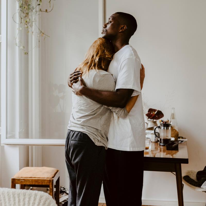 Son embracing his sad mother